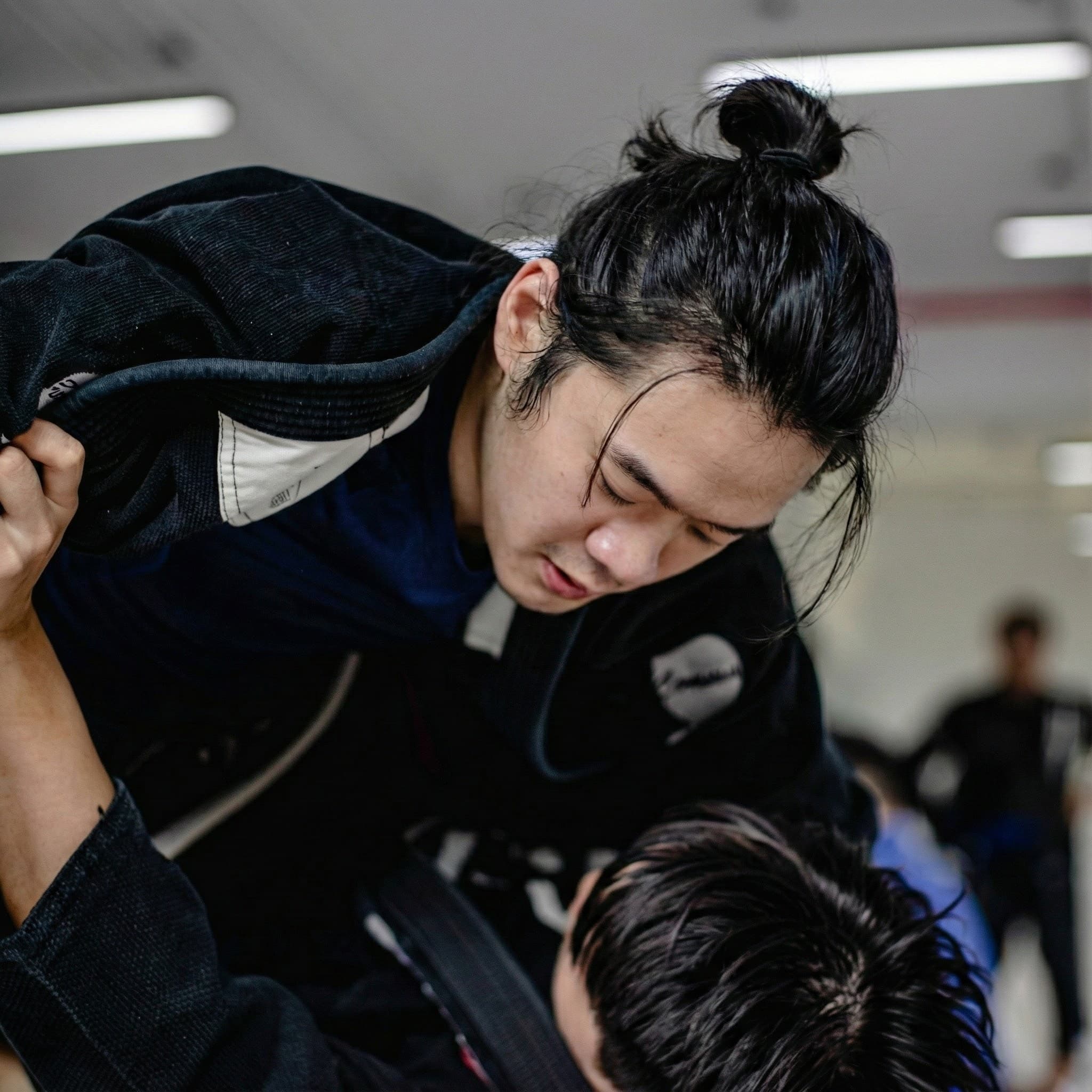 Chian training BJJ — focused, present, in flow